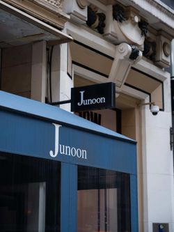 Junoon showcases its entrance signage and awning, emphasizing its upscale Indian restaurant identity in New York.